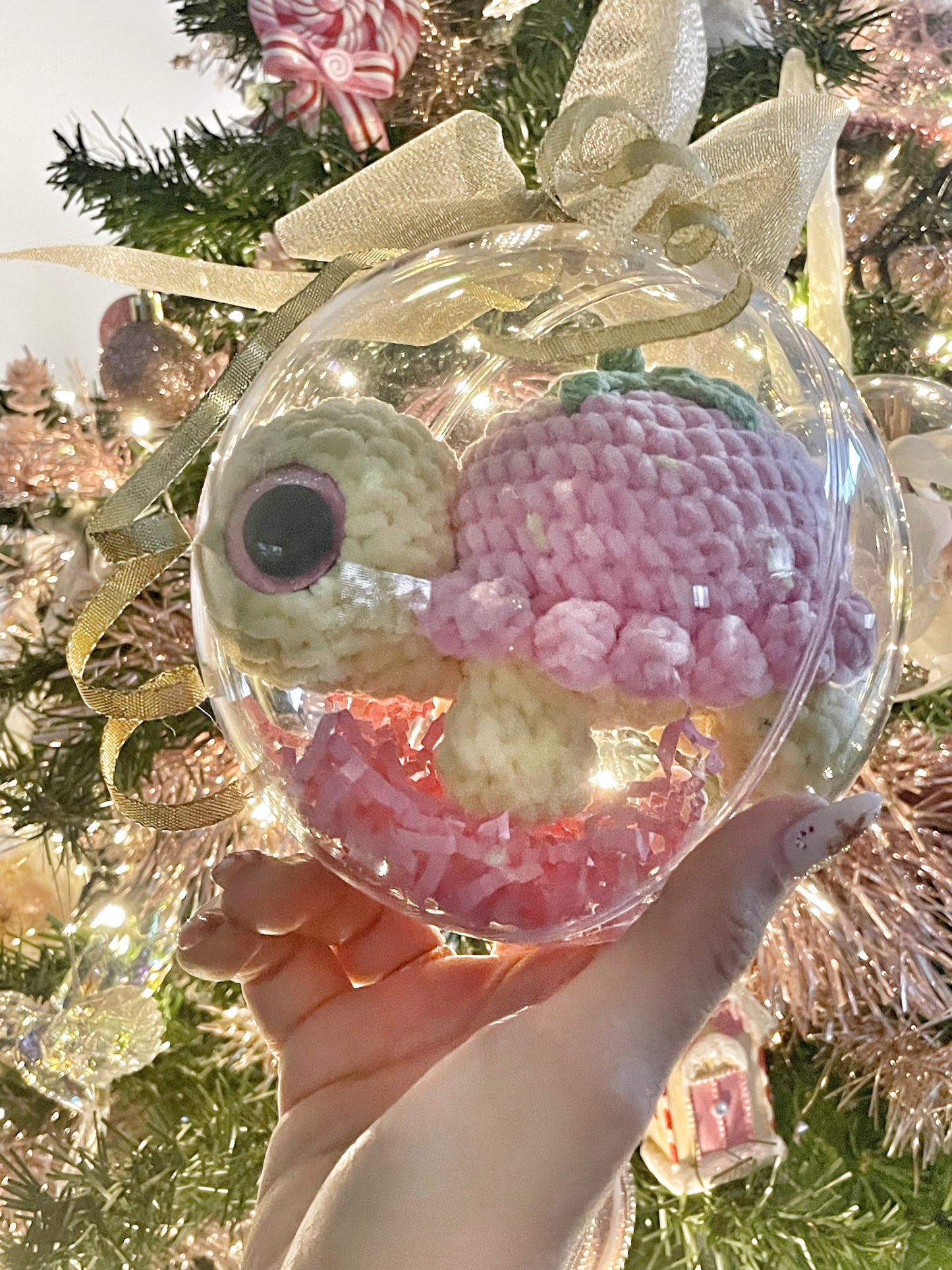 Strawberry baby turtle in big Christmas ball