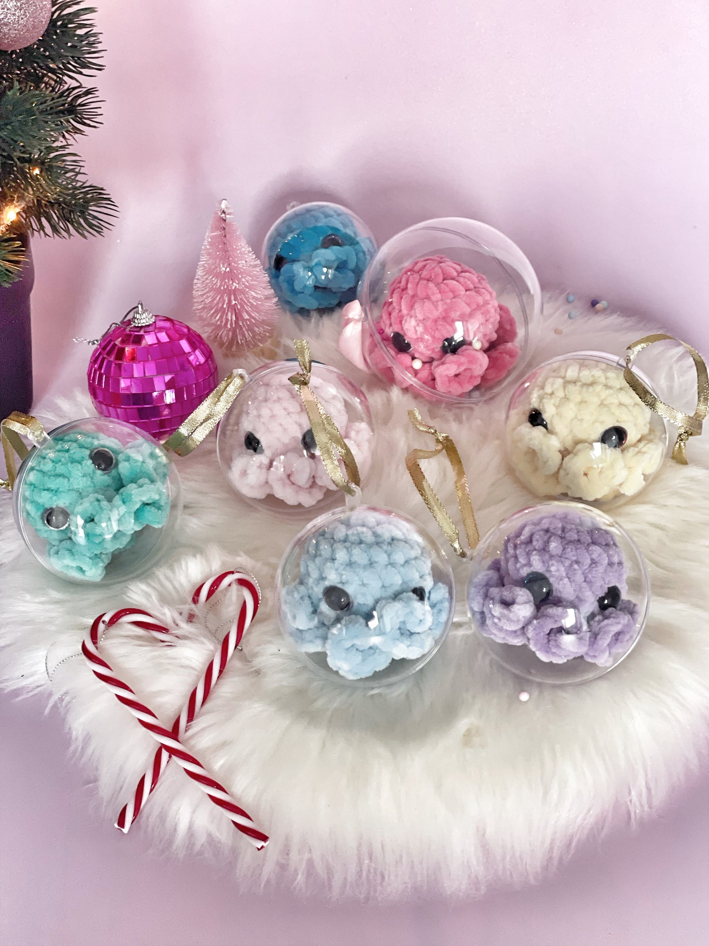 Baby octos in small Christmas ball